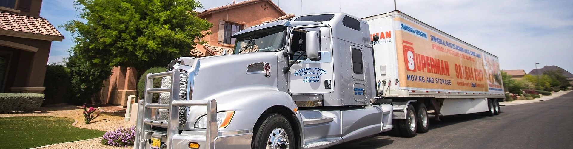 A Superman Moving & Storage semi truck loaded for a long-distance move